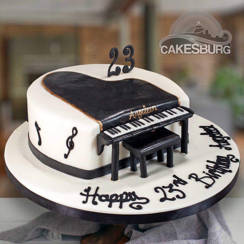 Birthday Cake Decorated With Fondant, Rounded, Symbolically Presenting  Piano And Cello Instruments. Stock Photo, Picture and Royalty Free Image.  Image 50905683.